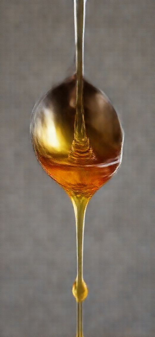 Spectacular Honey Dripping From Spoon Golden Wallpaper