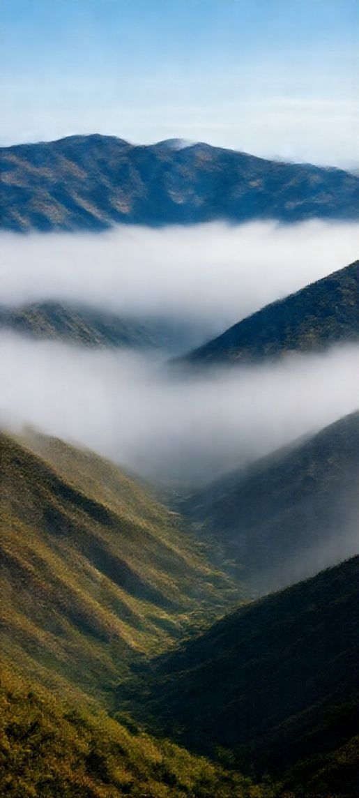 Fog Rolling Over Mountains Valley Photorealistic Wallpaper