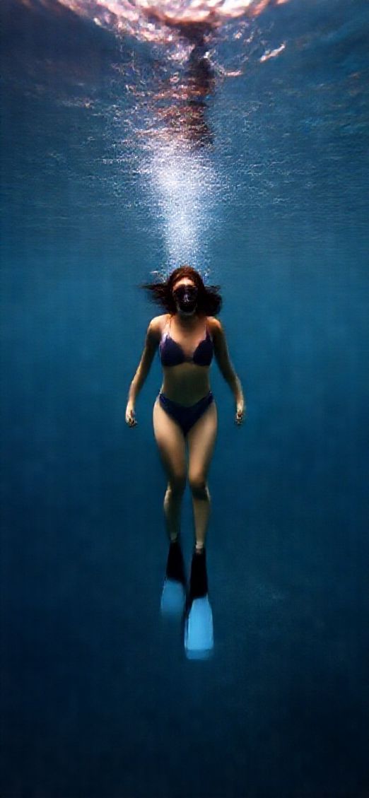 Freediver Descending Into Deep Blue Photorealistic Wallpaper